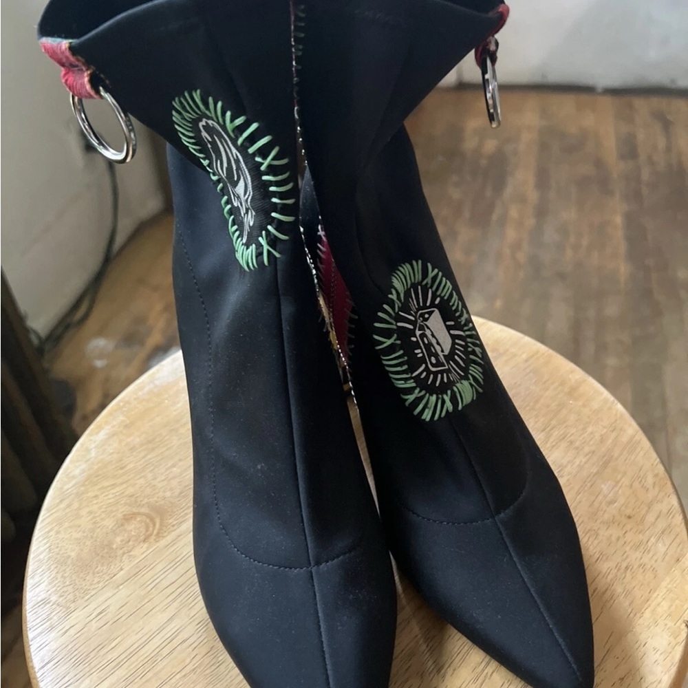 Dolls Kill Black Heeled Boots with Sleek Silhouette